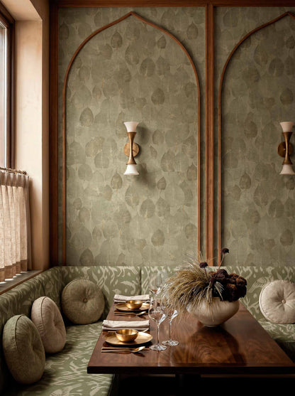Suman wallpaper by Coordonné in Moss, shown in a styled room