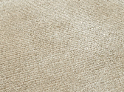 Thabor Loop Rug by Pierre Frey shown in a room setting (view 1)
