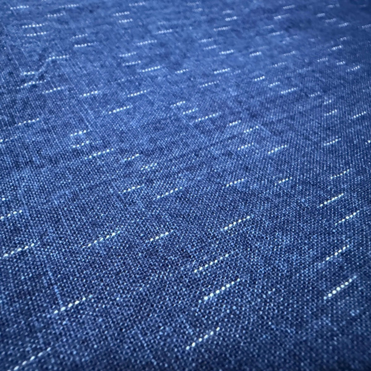 The ReBorn House TRH5779 Chiri-Gasuri Scattered Indigo Ikat Cotton in Kon Ground, colorway TRH5779.A, flat fabric swatch