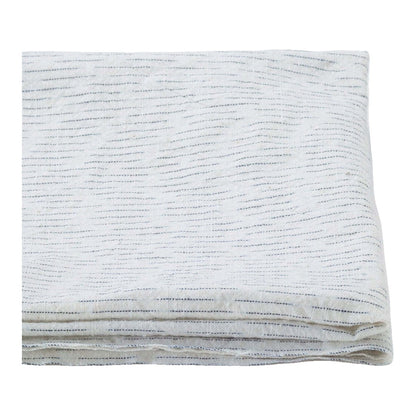 The ReBorn House TRH5779 Chiri-Gasuri Scattered Indigo Ikat Cotton in Shiro Ground, colorway TRH5779.B, folded on white