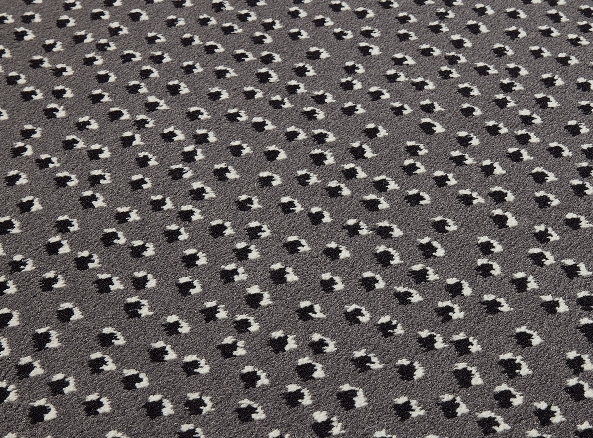 Toile Africaine Rug by Le Manach shown in a room setting (view 1)