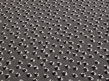 Toile Africaine Rug by Le Manach shown in a room setting (view 1)