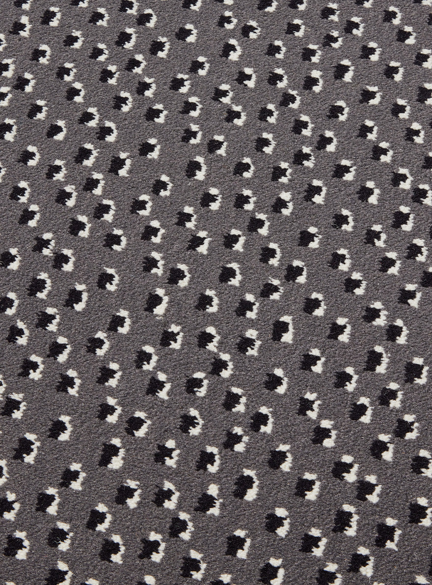 Toile Africaine Rug by Le Manach shown in a room setting (view 2)