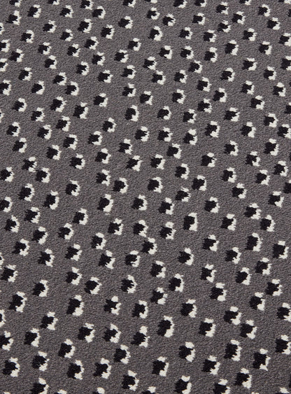 Toile Africaine Rug by Le Manach shown in a room setting (view 2)