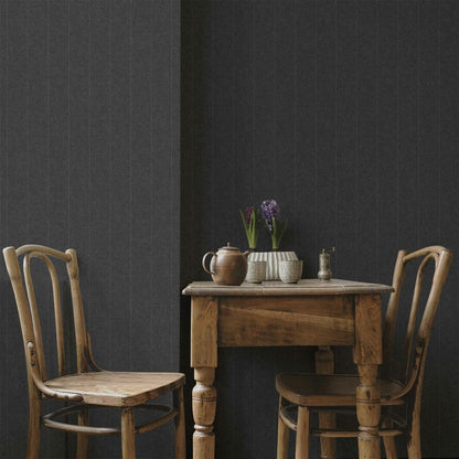 Twill wallpaper by Coordonné in Black, shown in a styled room