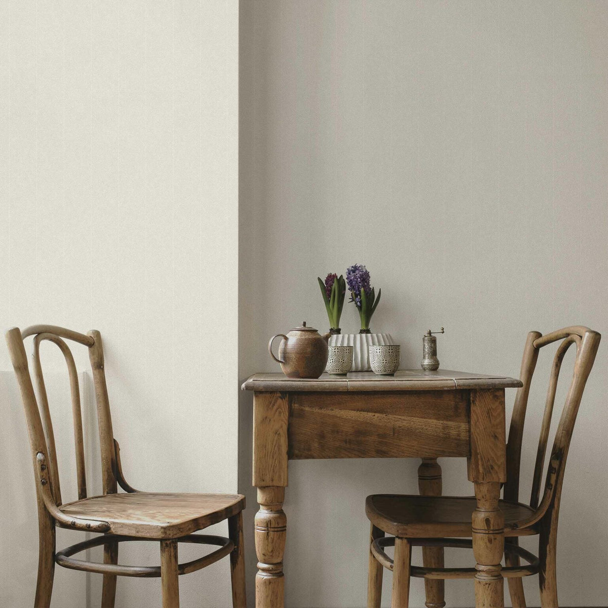 Twill wallpaper by Coordonné in Ice, shown in a styled room