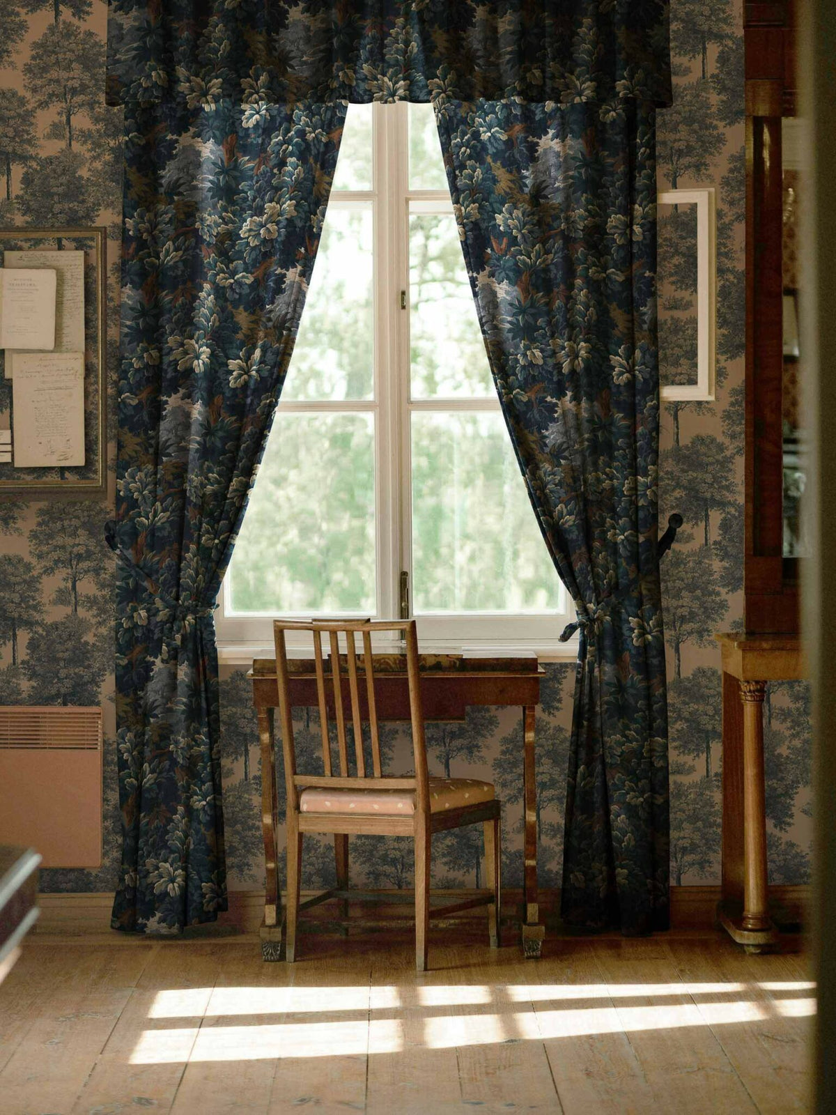 Verdure 16th fabric by Coordonné in Blue, shown in a styled room