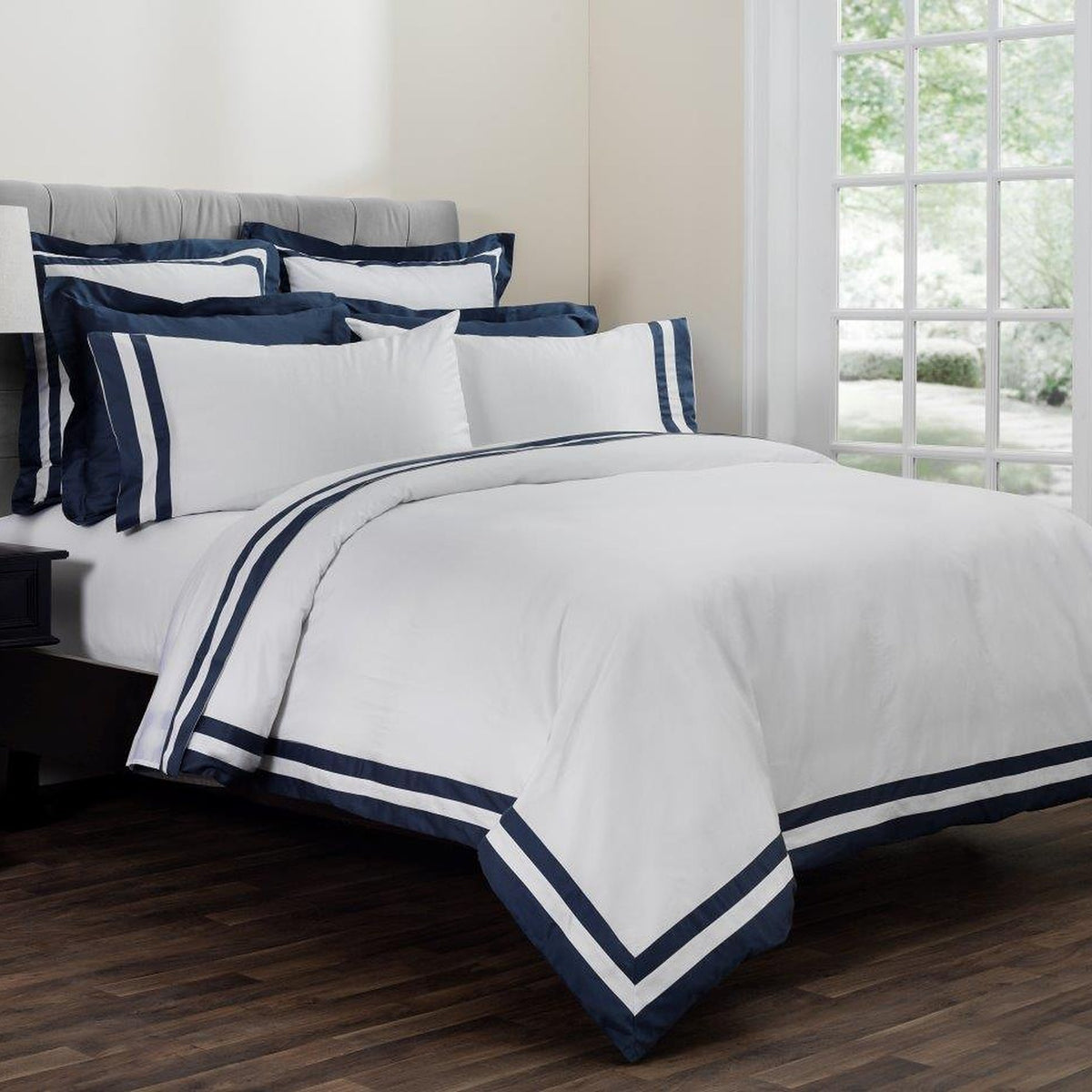 Vilanova Sateen Fitted Sheet by Downright, styled on a bed