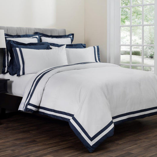 Vilanova Sateen Fitted Sheet by Downright, styled on a bed