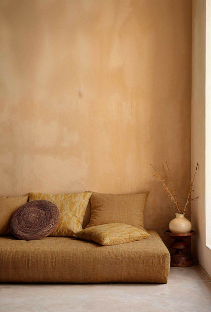Wave Dune fabric by Coordonné in Curry, shown in a styled room