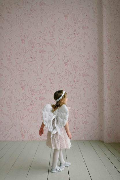 Zoology wallpaper by Coordonné in Candy, shown in a styled room