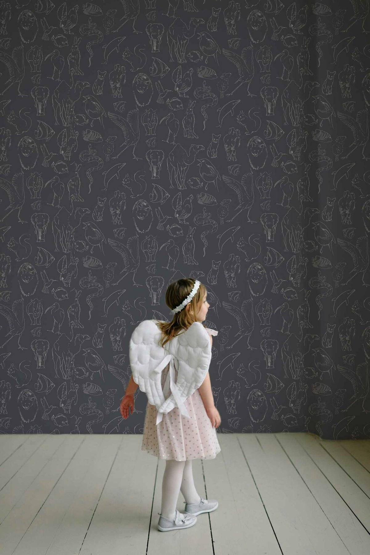 Zoology wallpaper by Coordonné in Chalk, shown in a styled room